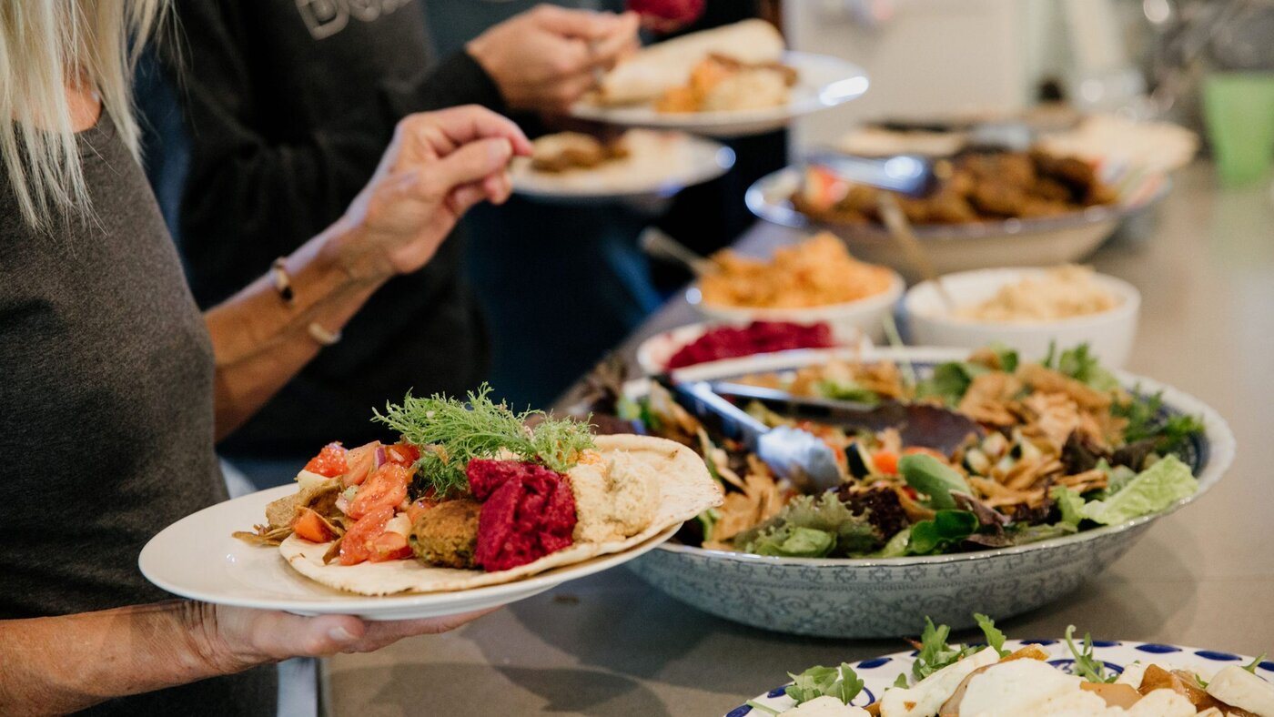 Guests serving wholesome catered retreat meals